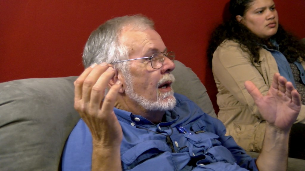Robin Hoover talks to students at his home.