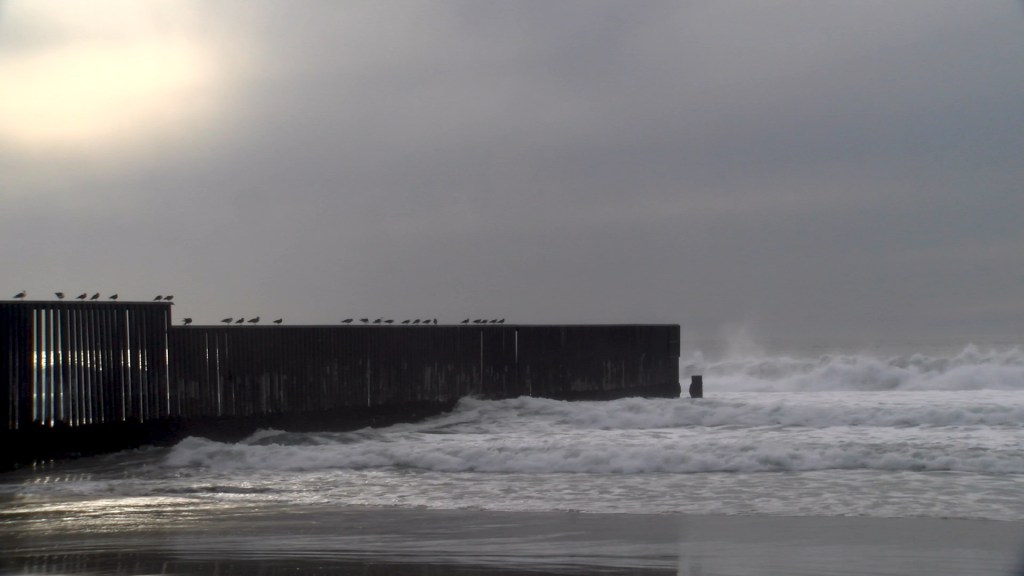 A section of the border fence in San Isidro that extends into the Pacific ocean.